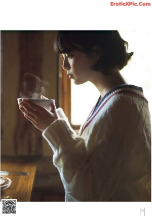 A magazine with a girl in a plaid shirt on the cover.