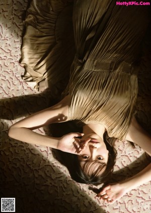 A collage of photos of a woman laying on a bed.