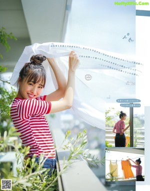 A woman is walking down the street carrying shopping bags.