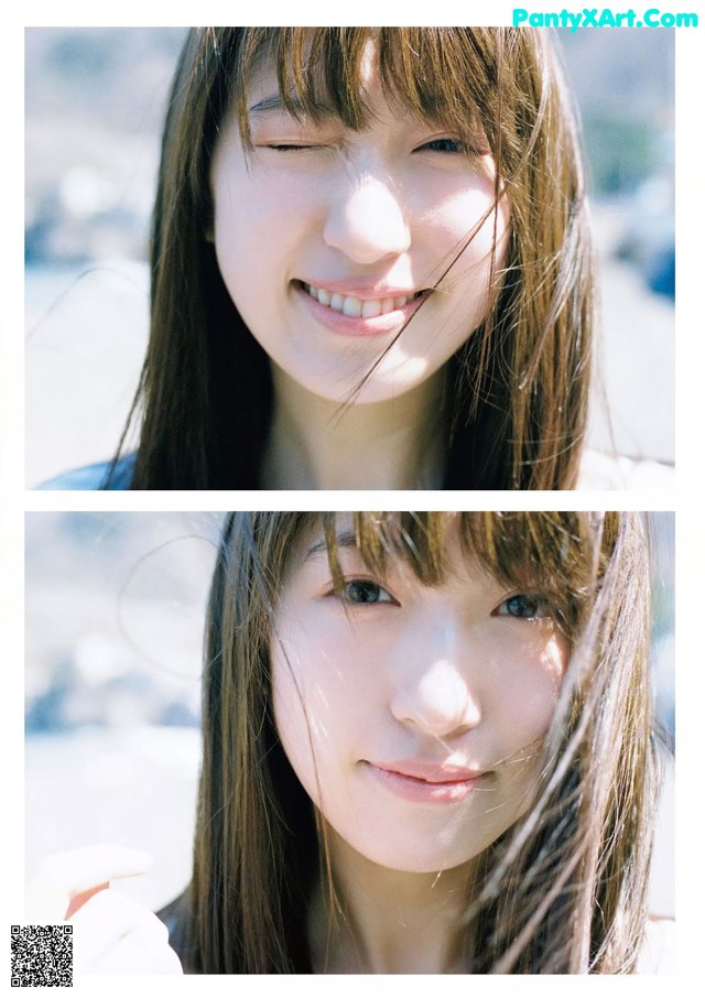 A woman with long brown hair smiling at the camera.