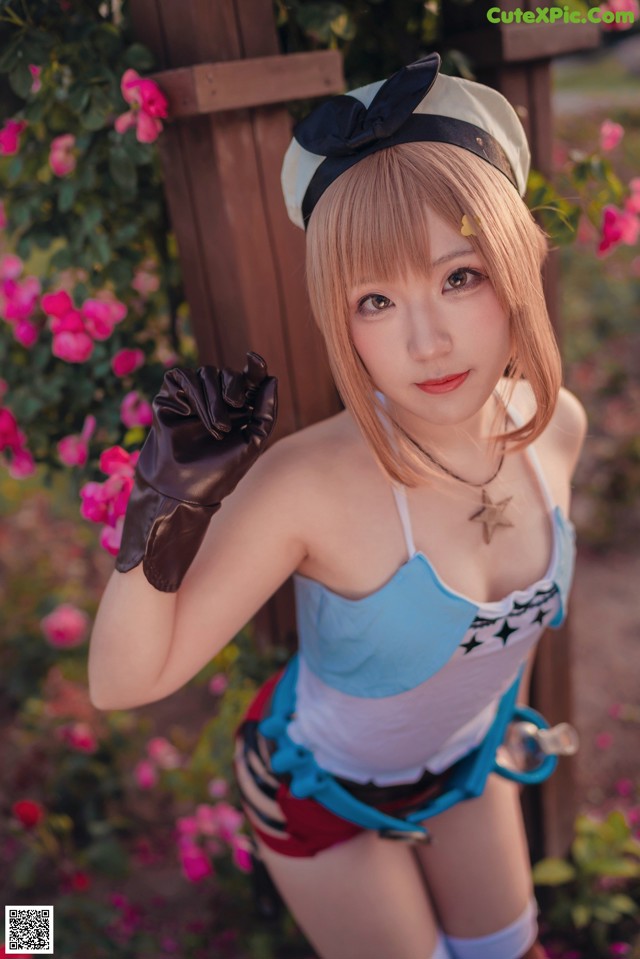 A woman in a sailor outfit posing for a picture.