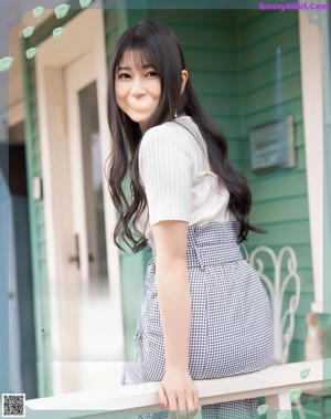 A magazine spread with a picture of a girl on a playground.