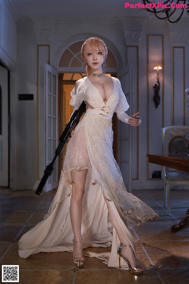 A woman in a white dress holding a gun.