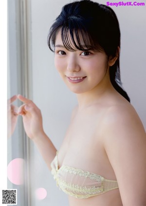 A magazine cover with two pictures of a woman in lingerie.