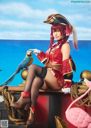 A woman in a pirate costume posing for a picture.